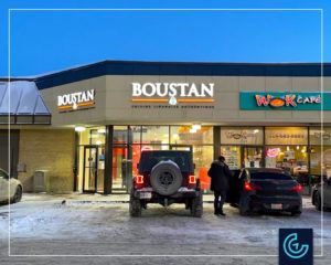 Backlit storefront sign in channel letters for the restaurant Boustan in DDO