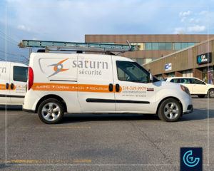 Vehicle lettering on a minivan 2015 Dodge RAM Promaster City for the security solutions provider Saturn Security