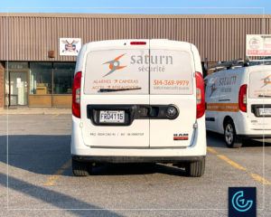 Vehicle lettering on a minivan 2015 Dodge RAM Promaster City for the security solutions provider Saturn Security