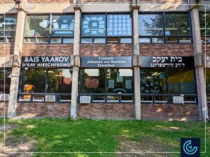 Building storefront signs in stainless steel canned letters on aluminium faces manufactured and installed for Beth Jacob seminary.