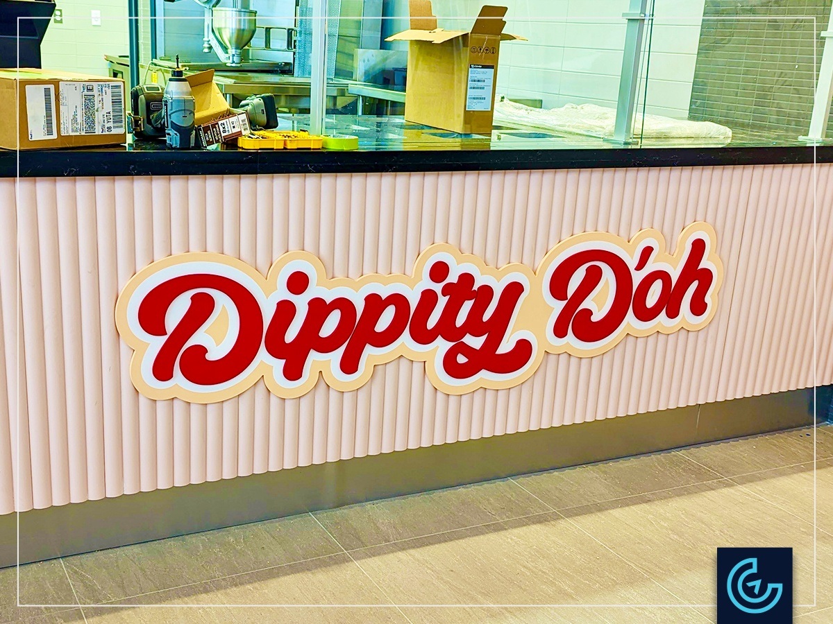 Interior decoration branding signage for the loukoumade donut restaurant Dippity D'oh in Forum Montreal.