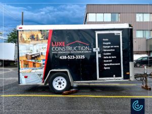 Partial wrap and lettering on a 12-foot enclosed trailer for a construction company LUXE Construction.