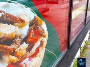 Temporary construction hoarding window graphics “Opening soon” designed, printed and installed for the upcoming location of the restaurant franchise Boustan in Pie-IX, Montreal-Nord.