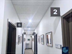 Room identification wall-mounted flag sign for the new wing of MDCM Clinic in Sainte-Catherine.