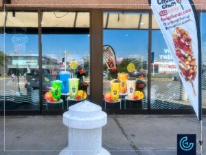 Promotional storefront window graphics with replaceable graphics designed, printed and installed for the bubble tea store L2 in Terrebonne.