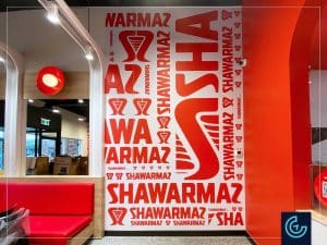 Branding wall graphics decoration and directional signage printed and installed for the new branch of the restaurant franchise Shawarmaz in Saint-Eustache.