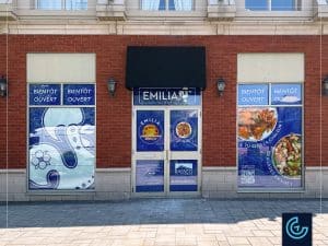 Temporary window graphics "Opening soon" designed, printed and installed for the Pourtugese-style grilled chicken restaurant franchise Emilia, branch in Ville Saint-Laurent.