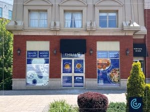 Temporary window graphics "Opening soon" designed, printed and installed for the Portuguese-style grilled chicken restaurant franchise Emilia, branch in Ville Saint-Laurent.