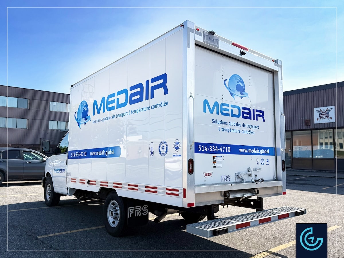 Cargo truck box lettering on a GMC truck with a 12-foot transport box for the international medical transportation company MEDAIR.
