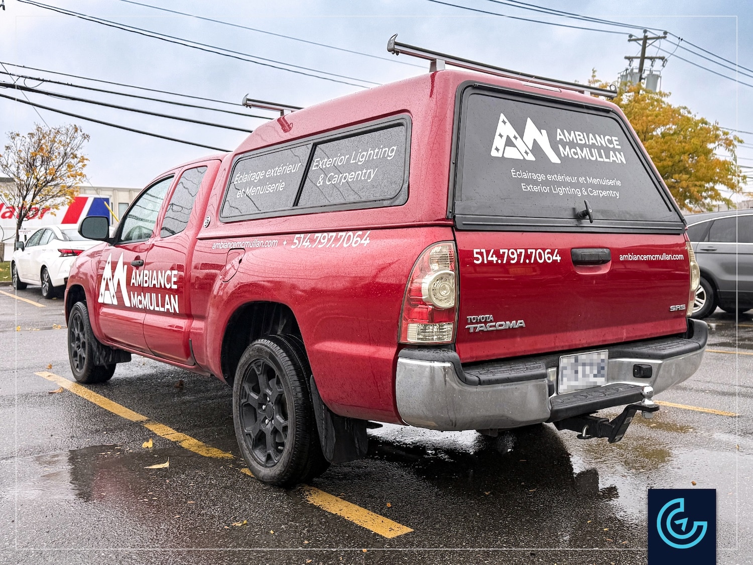 Pickup truck lettering on a 2015 Toyota Tacoma Extended Cab with a Fibrotech toolbox for the landscape lighting designer and carpenter Ambiance McMullan.