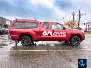 Pickup truck lettering on a 2015 Toyota Tacoma Extended Cab with a Fibrotech toolbox for the landscape lighting designer and carpenter Ambiance McMullan.