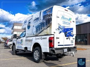 Pickup truck partial wrap and lettering of a 2024 Ford F-250 Regular Cab Long Bed with a Maranda truck cap V-375 for the commercial laundry equipments distributor Harco Canada.
